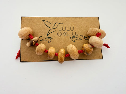 Pulsera de Palo Santo con Hilo Rojo | Protección
